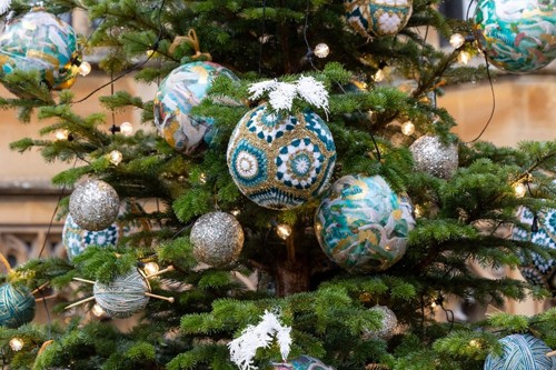 Crochet baubles on a Christmas tree.
