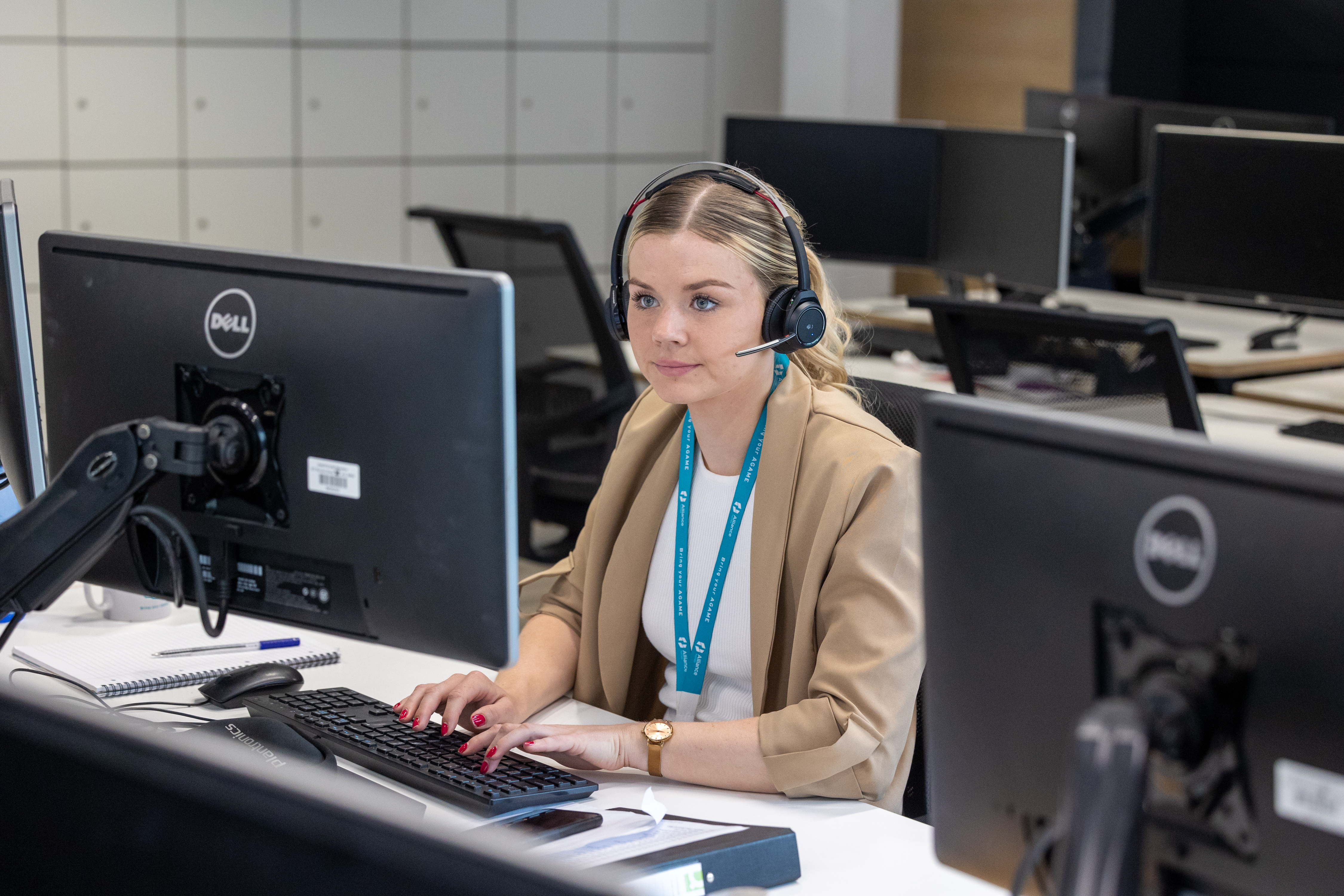 Lady sitting at a computer looking at the screen