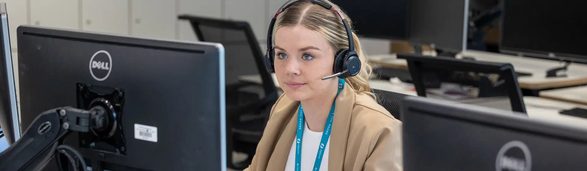 Lady sitting at a computer looking at the screen