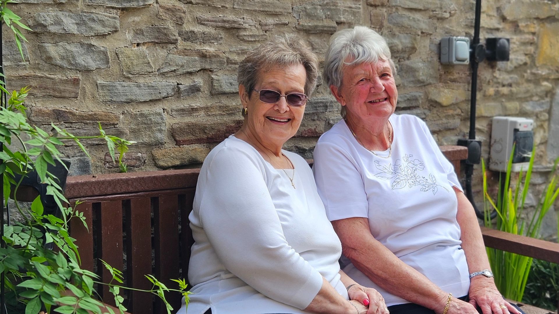 Customers Sitting On A Bench