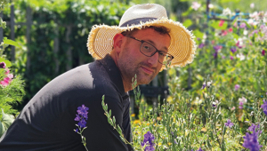 Image of man in hat gardening