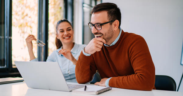 man and woman on laptop