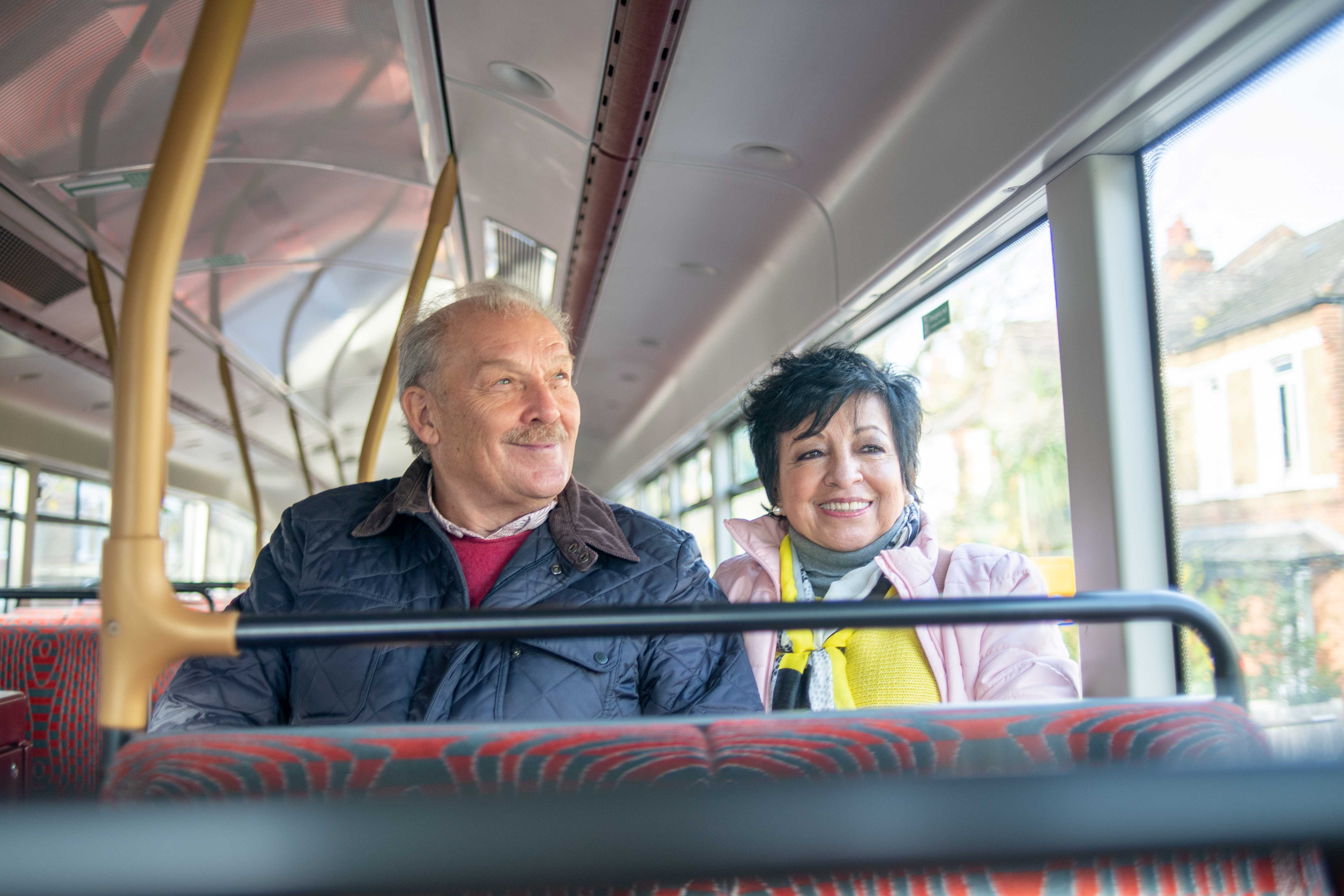 Older couple sitting on a bus