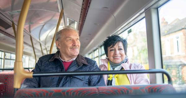 Older couple sitting on a bus