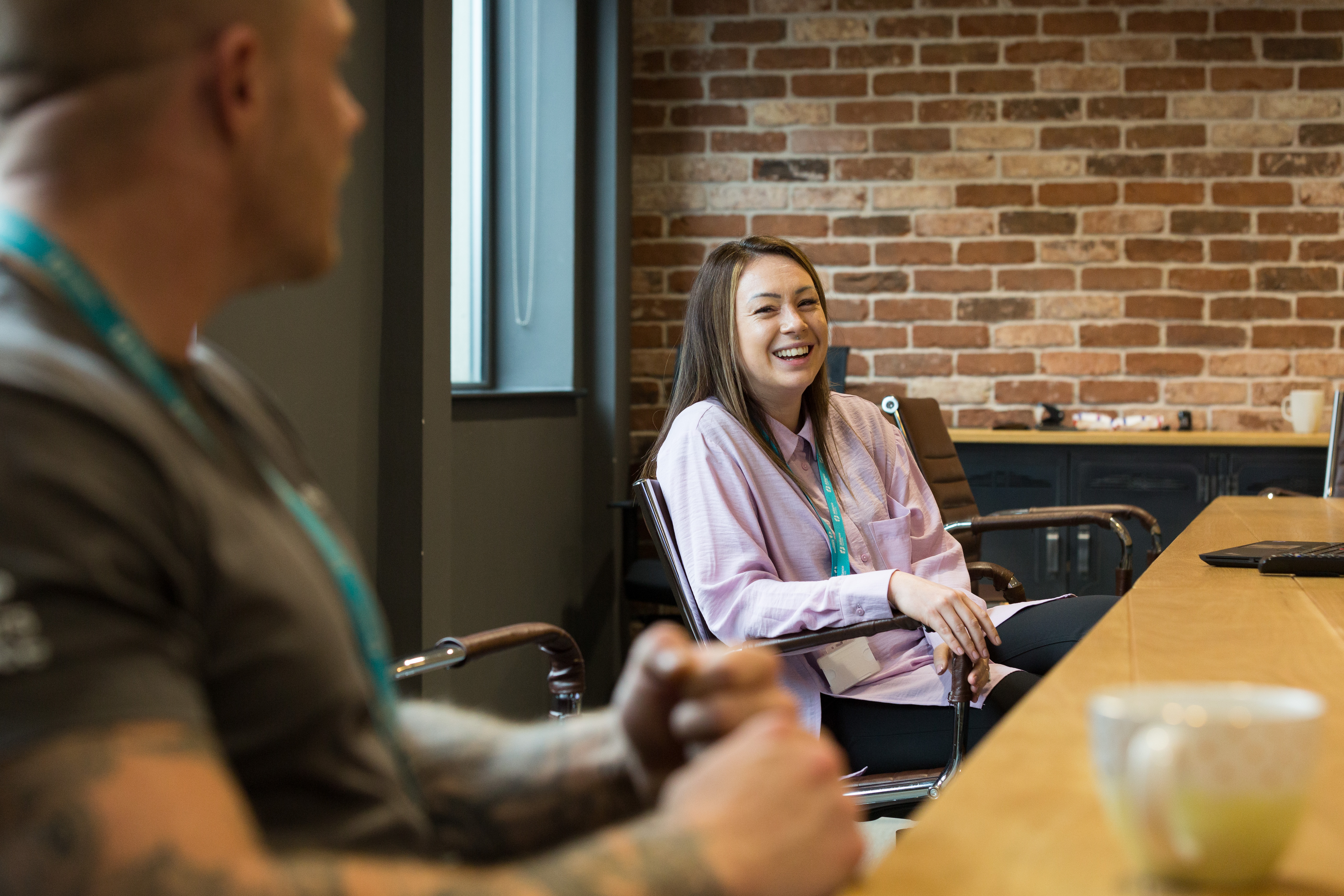 Lady in seat chatting in the office