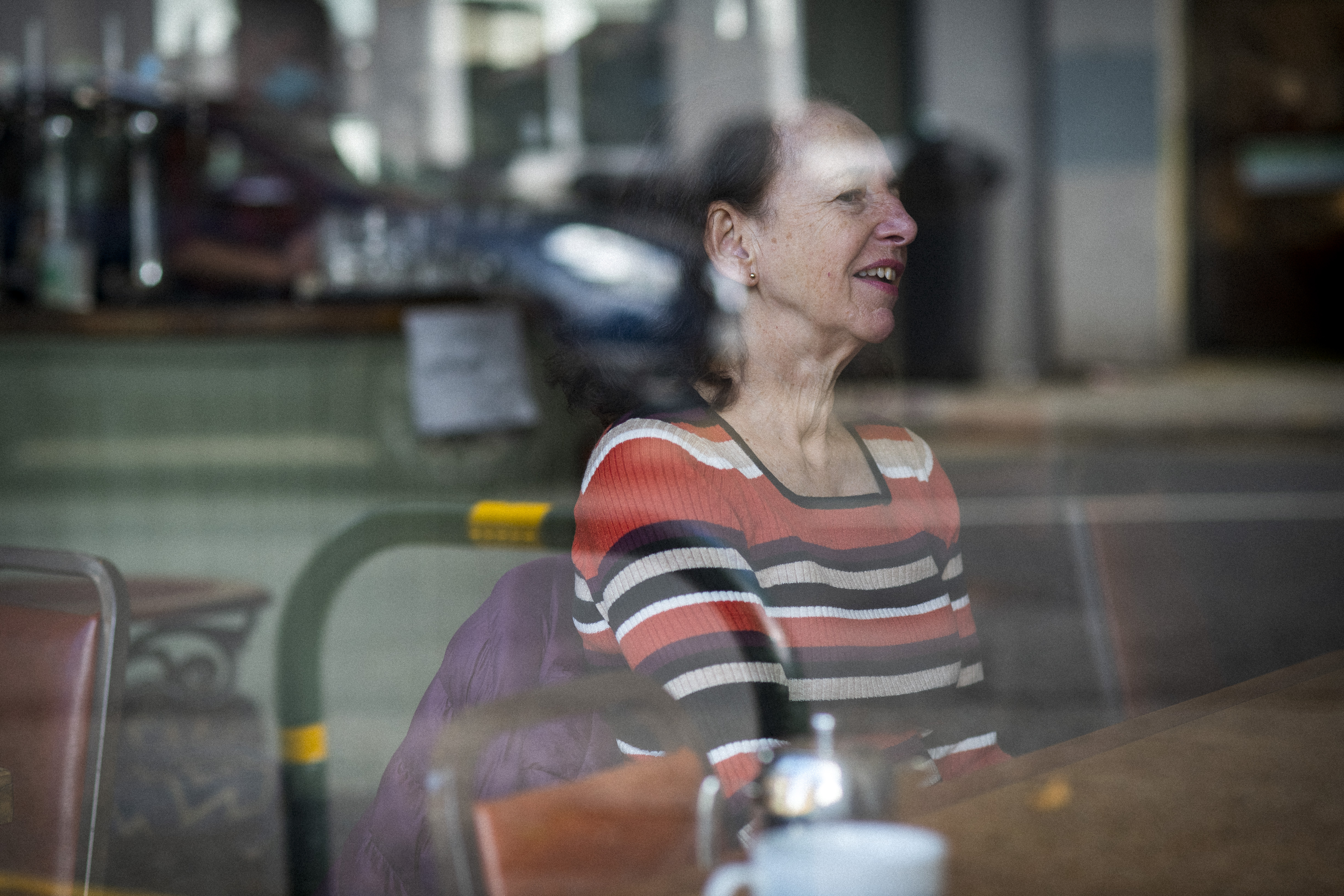 Lady At A Cafe Table