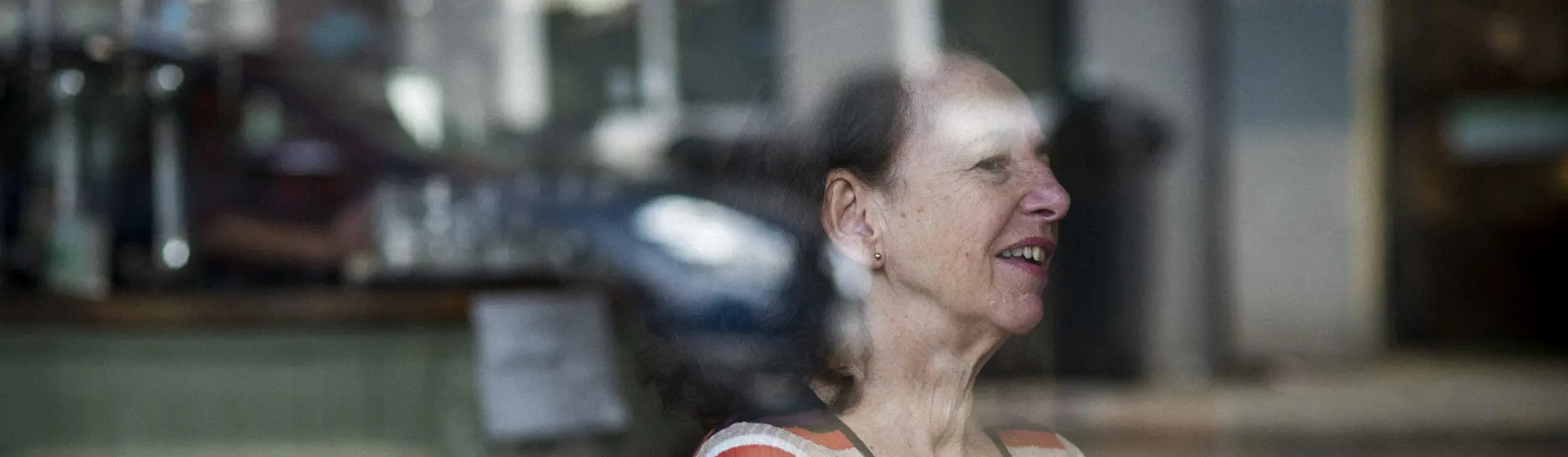 Lady At A Cafe Table
